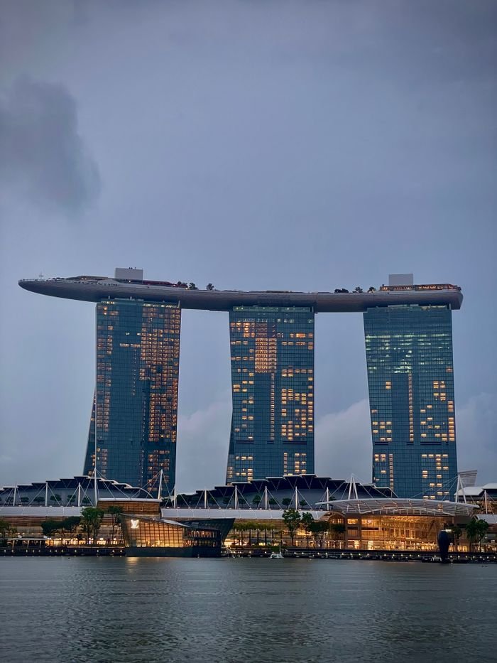 Dramatic view of Marina Bay Sands, Singapore's iconic skyline at dusk.